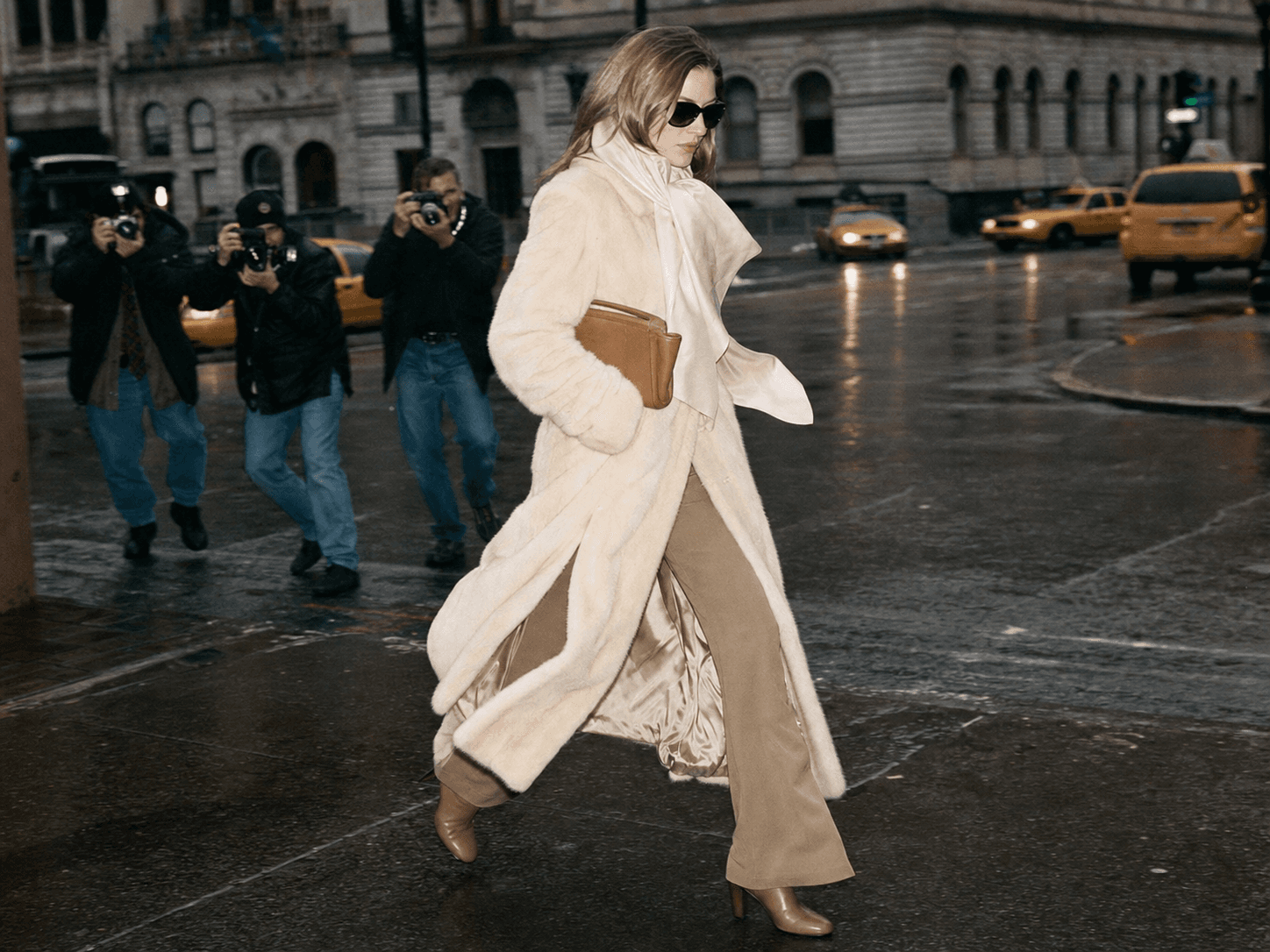 A fashionable woman carrying a substantial leather bag in the city